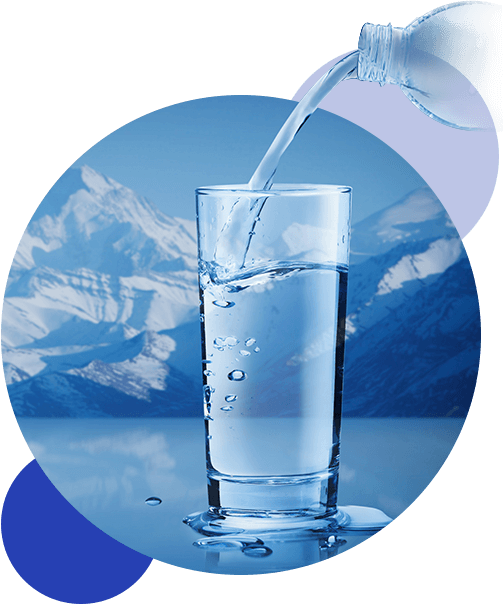 Hand pouring mineral water from bottle into a glass.